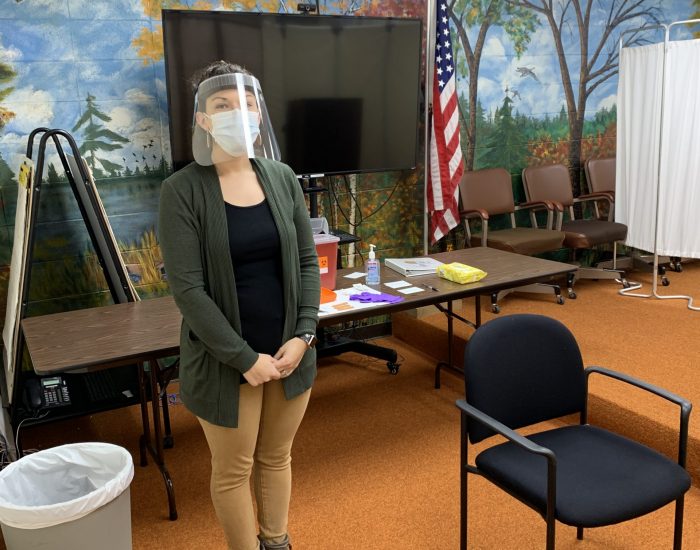 Vaccine clinic person with mask